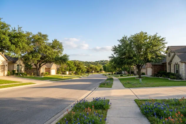 Quiet tree-lined residential street in the Leander, Texas area